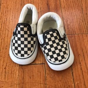 Black and white checkered Vans.